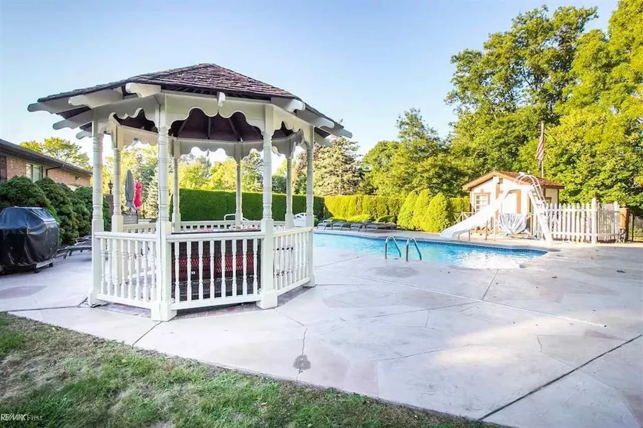 This retro $597k home in Clinton Township has a mirrored indoor koi pond &#151;&nbsp;and we are speechless