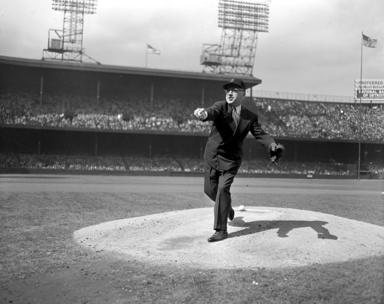 Mayor Albert Cobo throws out the first pitch at a Tigers game, 1950s.