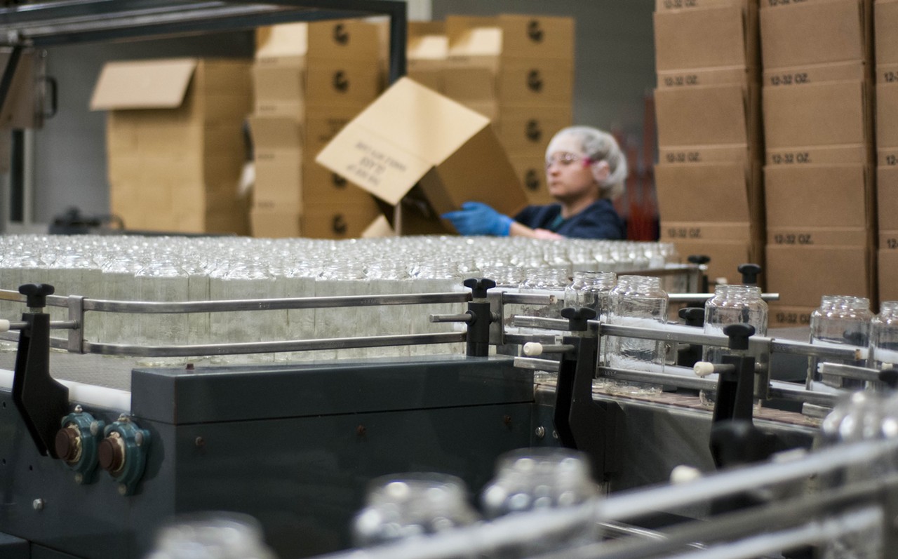 At the same time, an employee loads jars into a corral where the glass is automatically pulled into the production line. McClure's brought in a consultant who works in auto plants to help improve the pickle line's flow and efficiency.