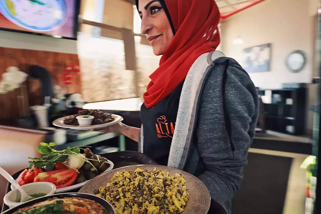 Susan Zaher serves the busy breakfast crowd, often educating first-time customers about traditional Lebanese breakfast dishes.