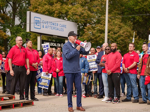 President Joe Biden addresses UAW members walking a picket line at the GM Willow Run Distribution Center, Tuesday, September 26, 2023, in Belleville, Michigan.