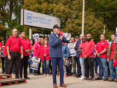 President Joe Biden addresses UAW members walking a picket line at the GM Willow Run Distribution Center, Tuesday, September 26, 2023, in Belleville, Michigan.