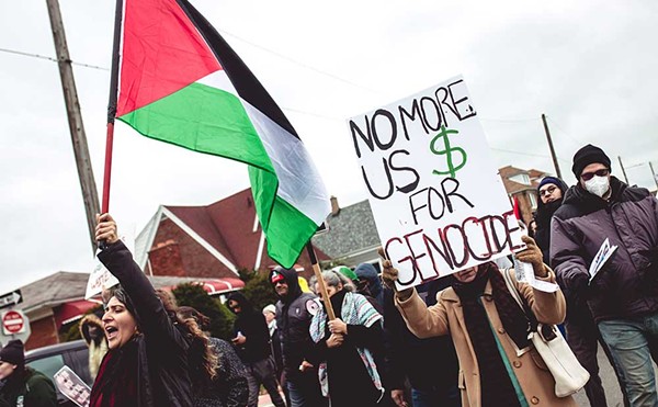 Protesters call for an end to Israel’s attacks on Gaza at a Detroit-area rally.