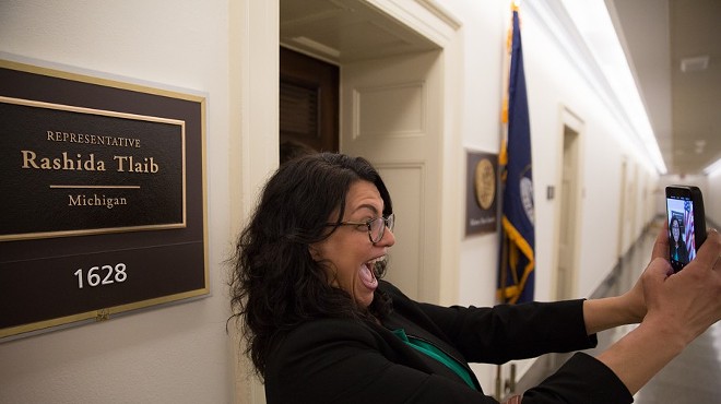 Rashida Tlaib snaps a selfie in front of her new office in 2019.