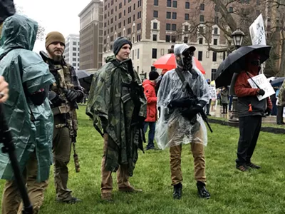 Protesters with rifles outside the state Capitol