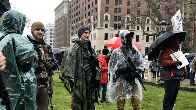 Protesters with rifles outside the state Capitol