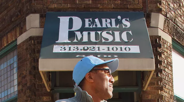 Walter Esaw in front of his store. - Detroitblogger John