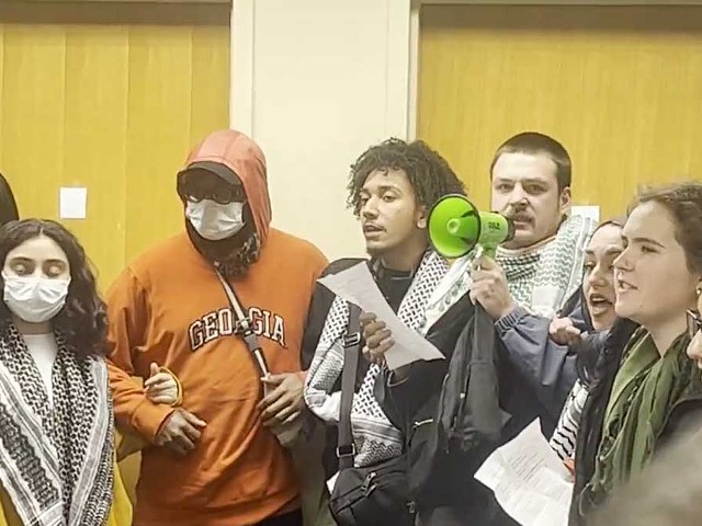 A still from a video showing students and staff at Wayne State University who were removed after demanding the school divest from Israel.