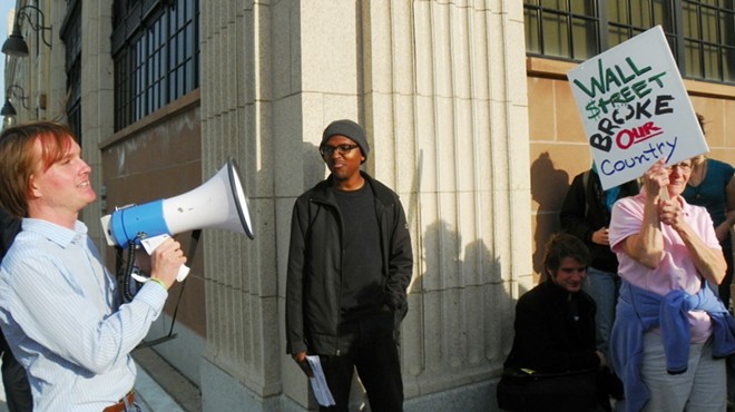 Who’s the criminal? Occupy Detroit protesters ask